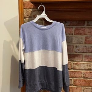 A blue white and gray light kids sweater